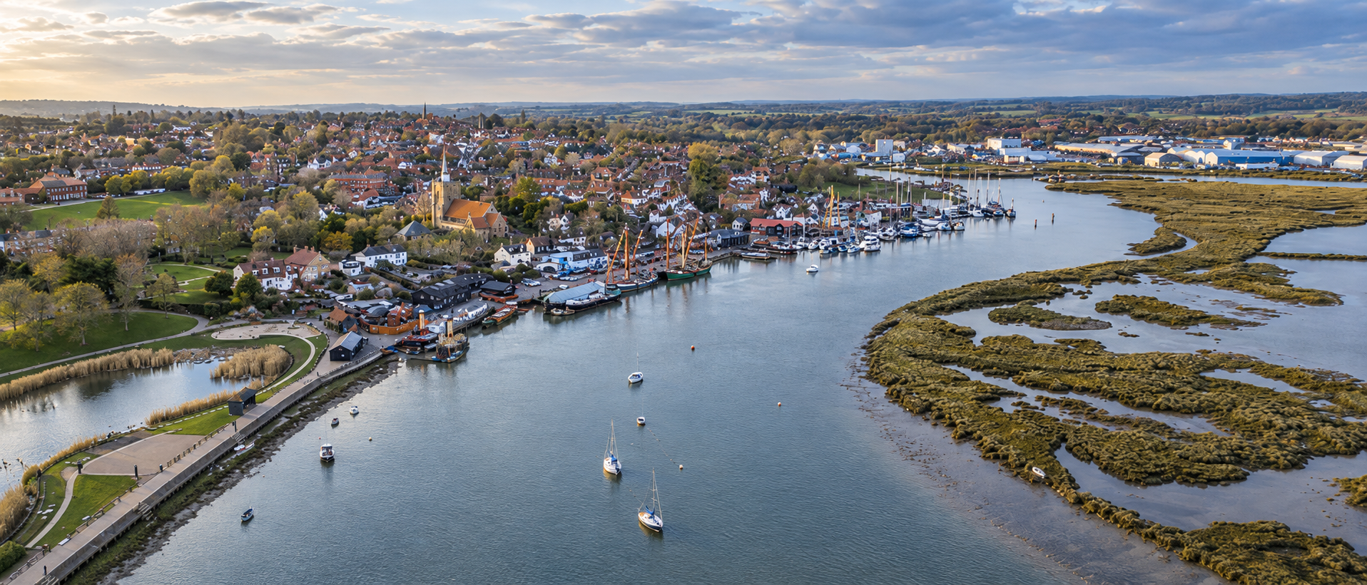 Aerial panorama of Maldon waterfront and the estuary in warm evening light.